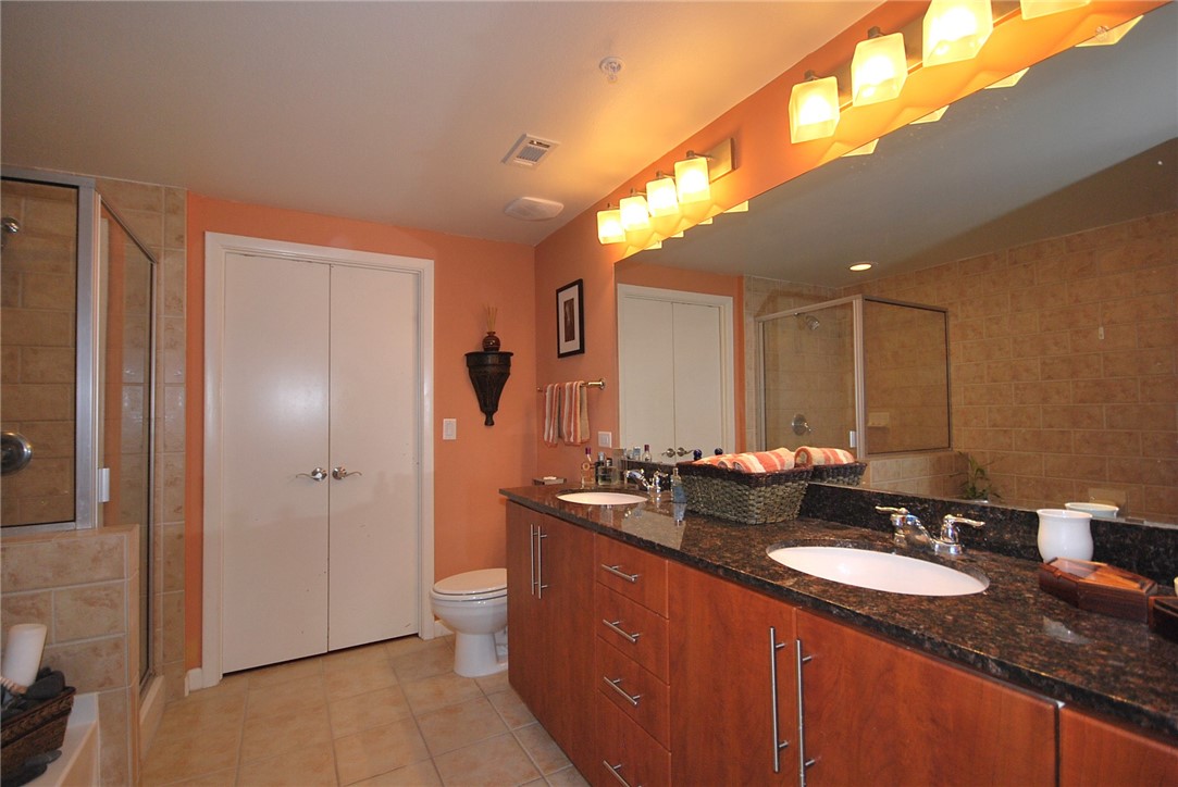 54 Rainey Street, Unit 509 Austin, TX 78701 - Photo 19 of 33 a bathroom with double sink and a mirror