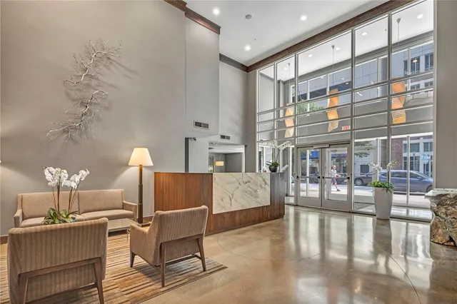 a living room with fireplace furniture and a table