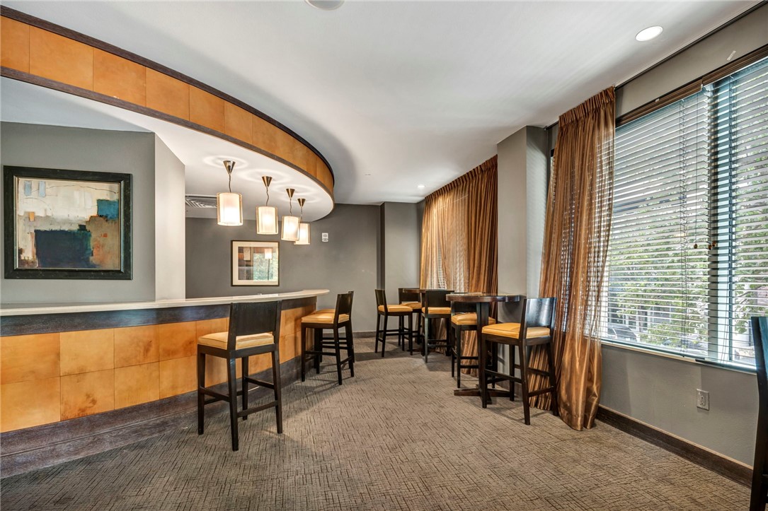 54 Rainey Street, Unit 509 Austin, TX 78701 - Photo 28 of 33 a living room with furniture and a large window