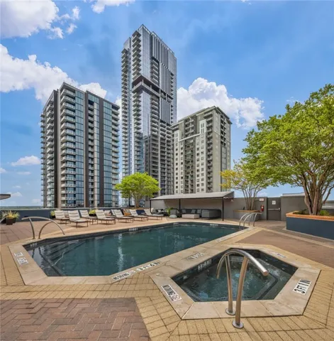 a view of a swimming pool with a patio