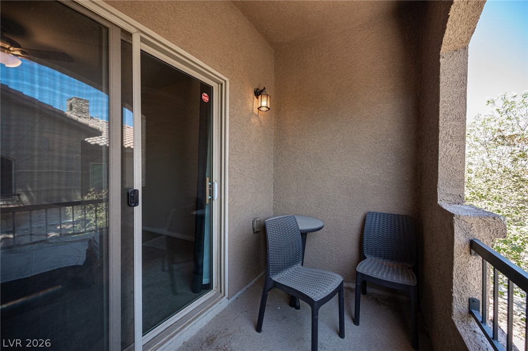7701 West Robindale Road, Unit 274 Las Vegas, NV 89113 - Photo 34 of 38 This cozy outdoor space offers a private retreat for relaxation and enjoying the views.