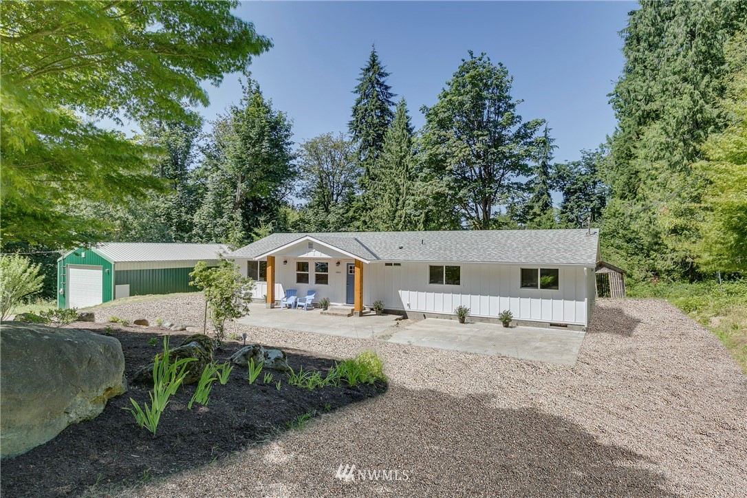 16623 Three Lakes Road Snohomish, WA 98290 - Photo 1 of 36 a front view of a house with garden
