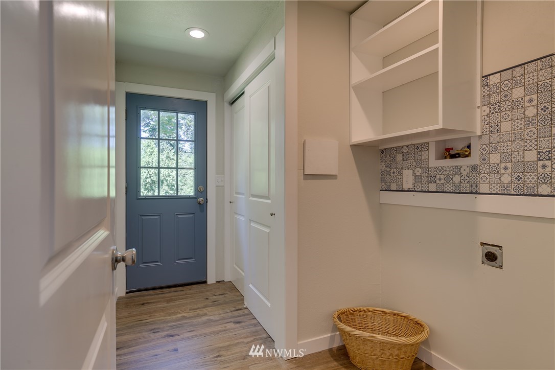 16623 Three Lakes Road Snohomish, WA 98290 - Photo 12 of 36 a bathroom with a granite countertop sink a toilet and a mirror