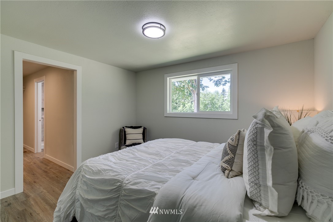 16623 Three Lakes Road Snohomish, WA 98290 - Photo 16 of 36 a bedroom with a bed and a window