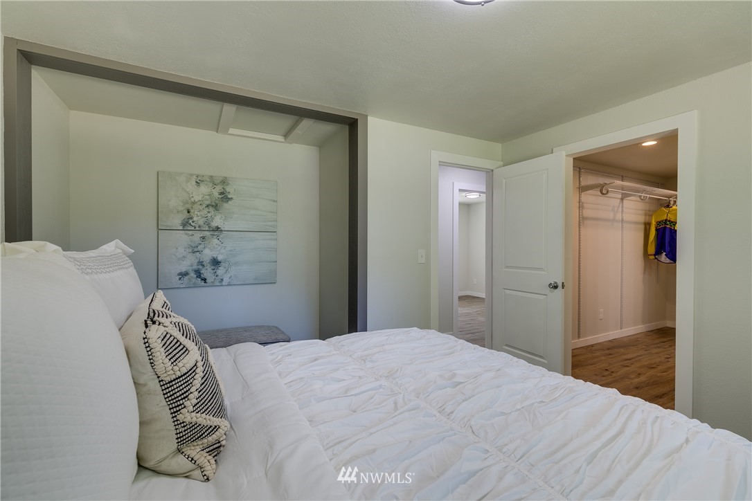 16623 Three Lakes Road Snohomish, WA 98290 - Photo 17 of 36 a bedroom with a bed and a painting on the wall