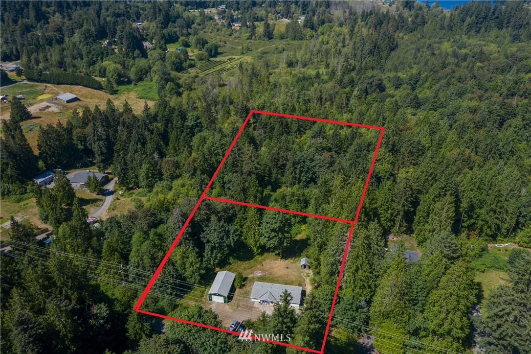 16623 Three Lakes Road Snohomish, WA 98290 - Photo 29 of 36 a view of a city with lush green forest