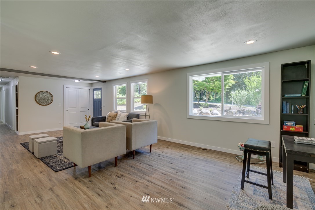 16623 Three Lakes Road Snohomish, WA 98290 - Photo 6 of 36 a living room with furniture a window and wooden floor
