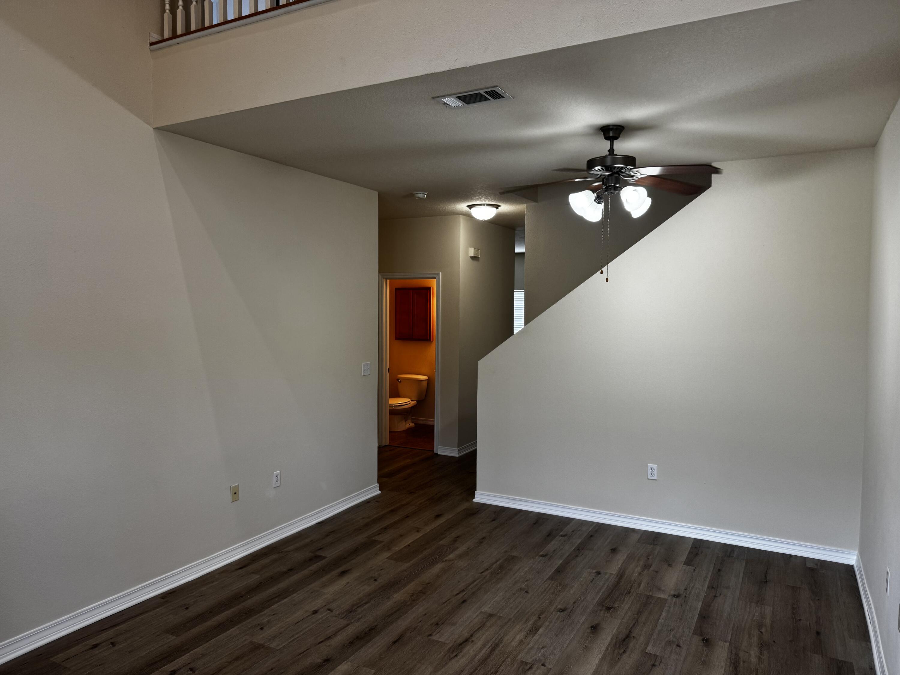 1512 Bentley Circle Fort Walton Beach, FL 32547 - Photo 3 of 12 a view of an empty room with wooden floor