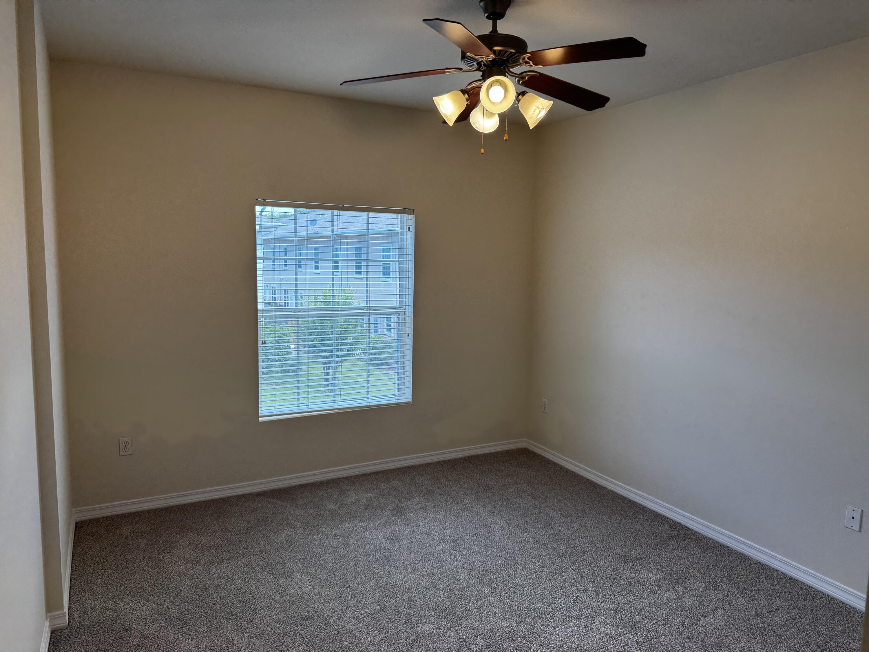 1512 Bentley Circle Fort Walton Beach, FL 32547 - Photo 8 of 12 an empty room with a window and a fan