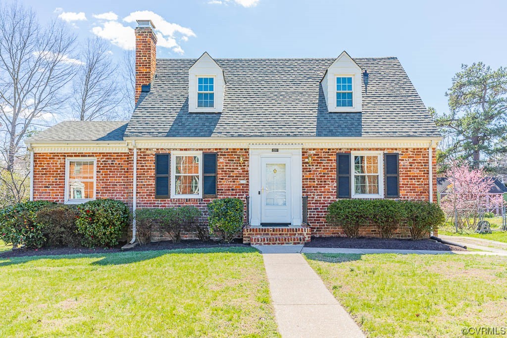 a front view of a house with swimming pool and porch