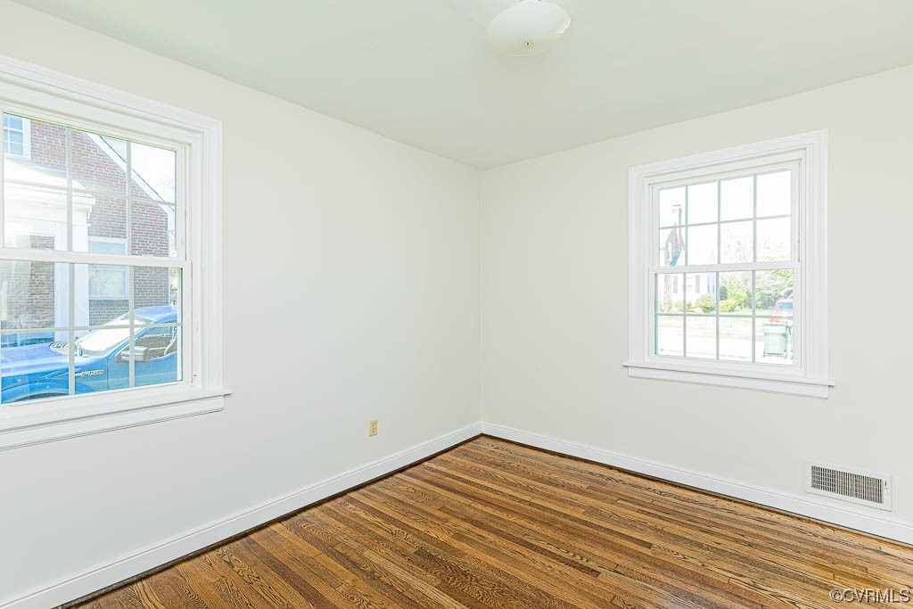 2317 New Berne Road Henrico, VA 23228 - Photo 14 of 37 an empty room with wooden floor and windows