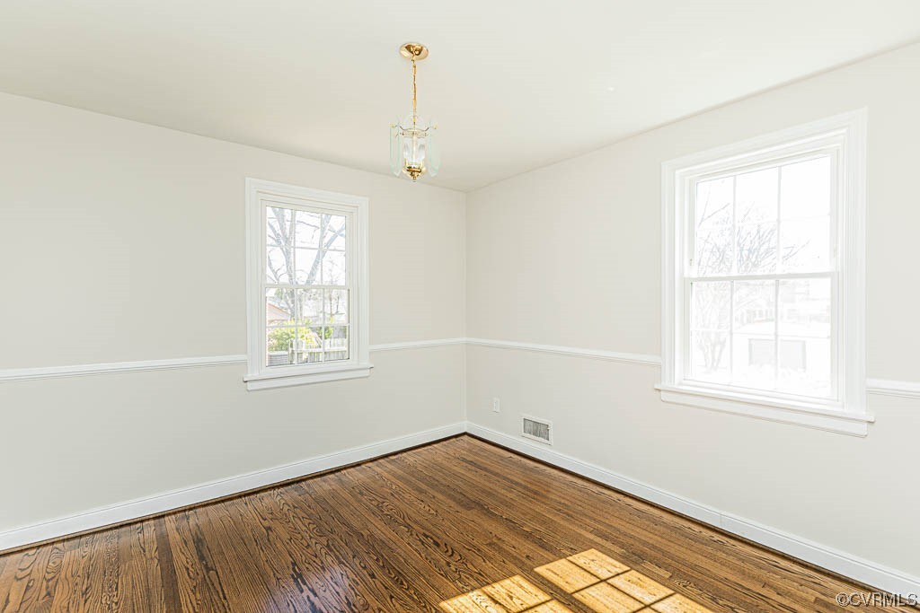 2317 New Berne Road Henrico, VA 23228 - Photo 15 of 37 an empty room with wooden floor and windows