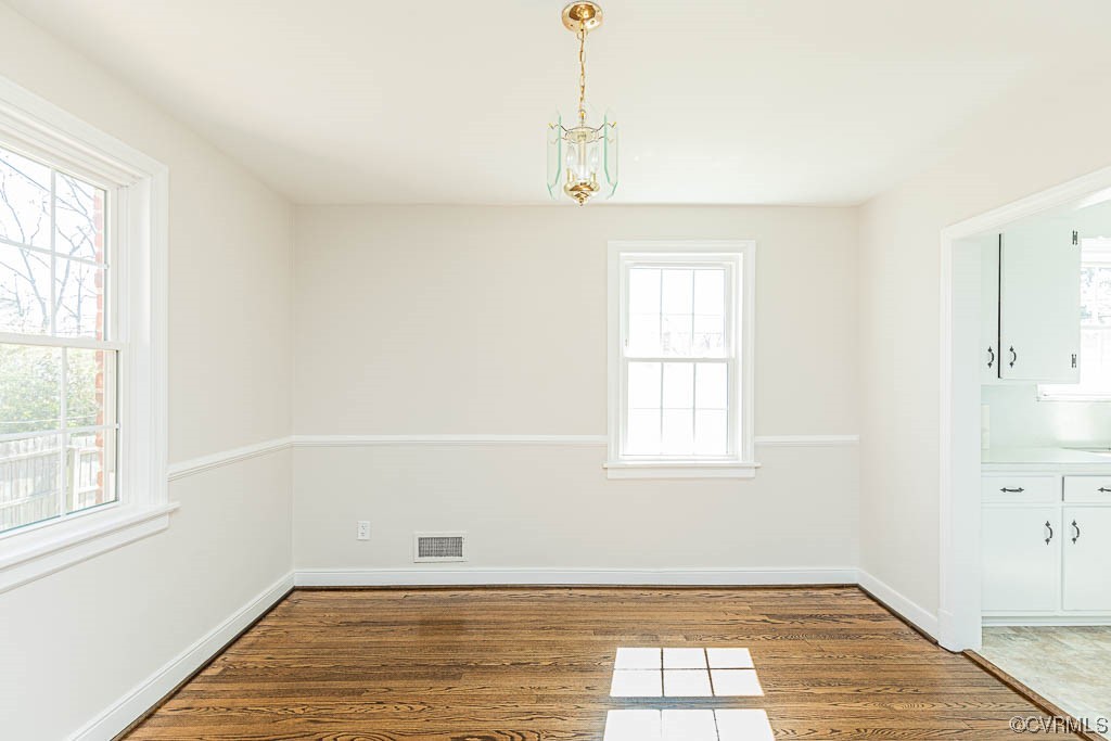 2317 New Berne Road Henrico, VA 23228 - Photo 18 of 37 wooden floor in an empty room with a window