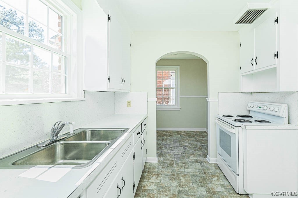 2317 New Berne Road Henrico, VA 23228 - Photo 23 of 37 a kitchen with a sink stove and cabinets