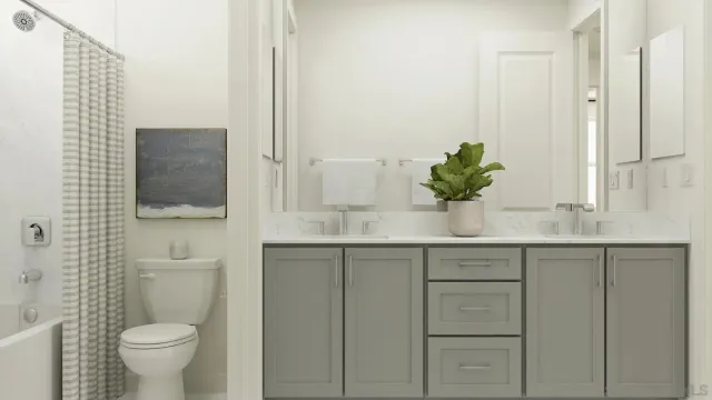 a bathroom with a granite countertop sink a toilet and mirror