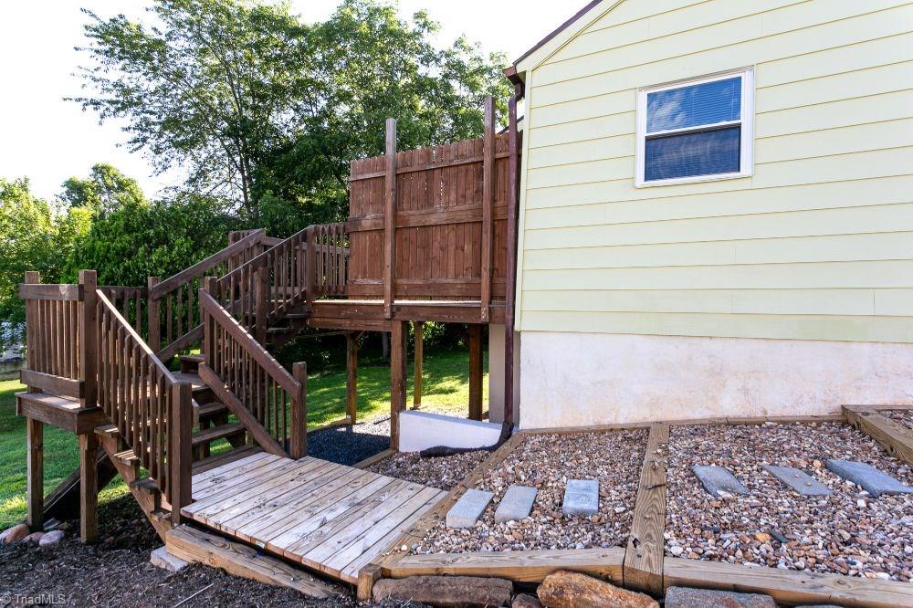 123 Hudson Street Elkin, NC 28621 - Photo 8 of 25 View of deck and steps leading to side of home.