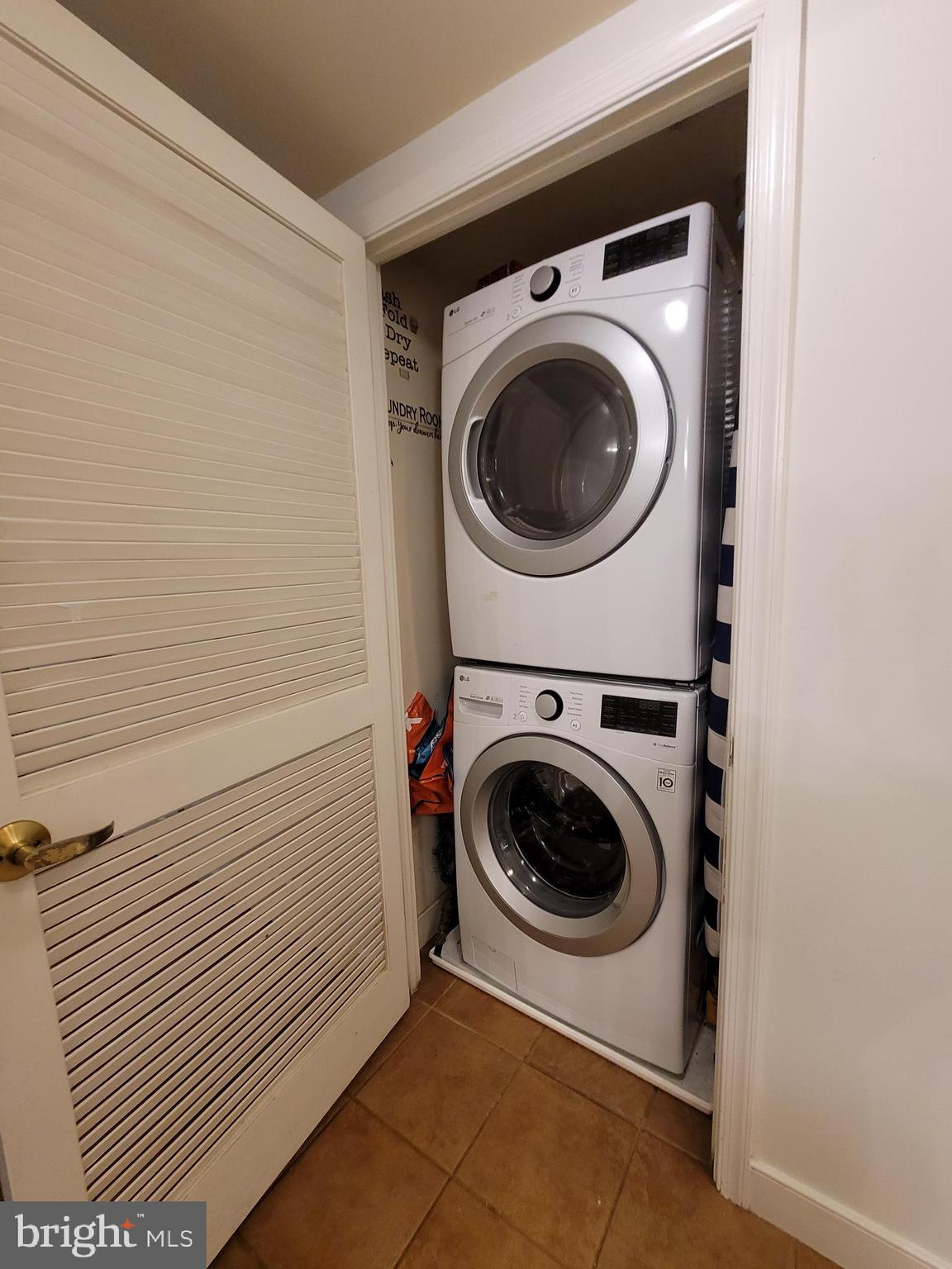 616 E Street Northwest, Unit 1007 Washington, DC 20004 - Photo 20 of 67 a utility room with dryer and washer