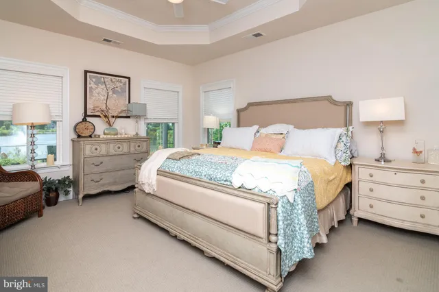 a spacious bedroom with a bed and a couch