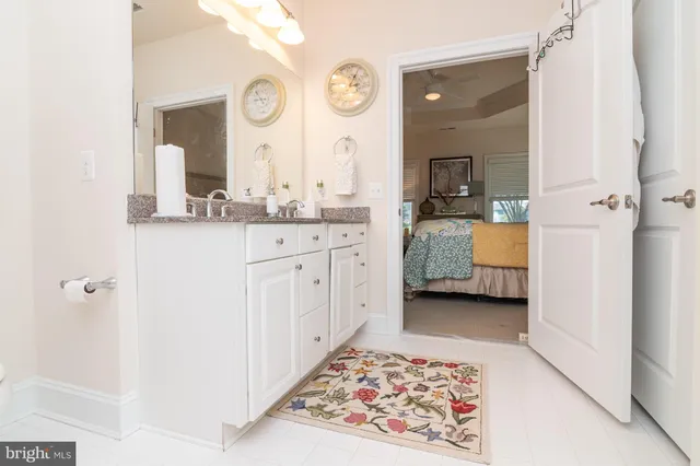a large bathroom with a double vanity sink and a mirror