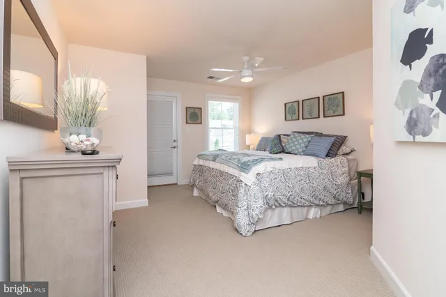 a bedroom with a bed and a mirror