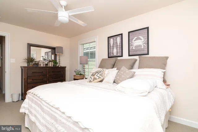 a bedroom with a bed and a dresser