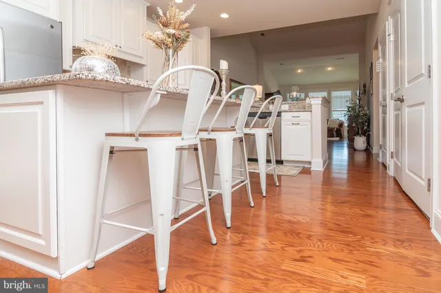 a view of a room with lots of wooden furniture