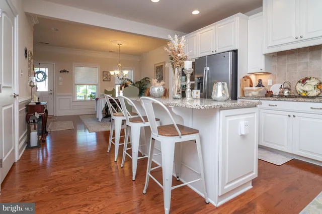 a view of a dining area with furniture and wooden floor