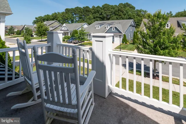 a view of a balcony with wooden floor