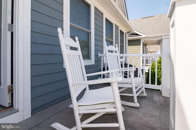 a view of an outdoor sitting area with wooden walls