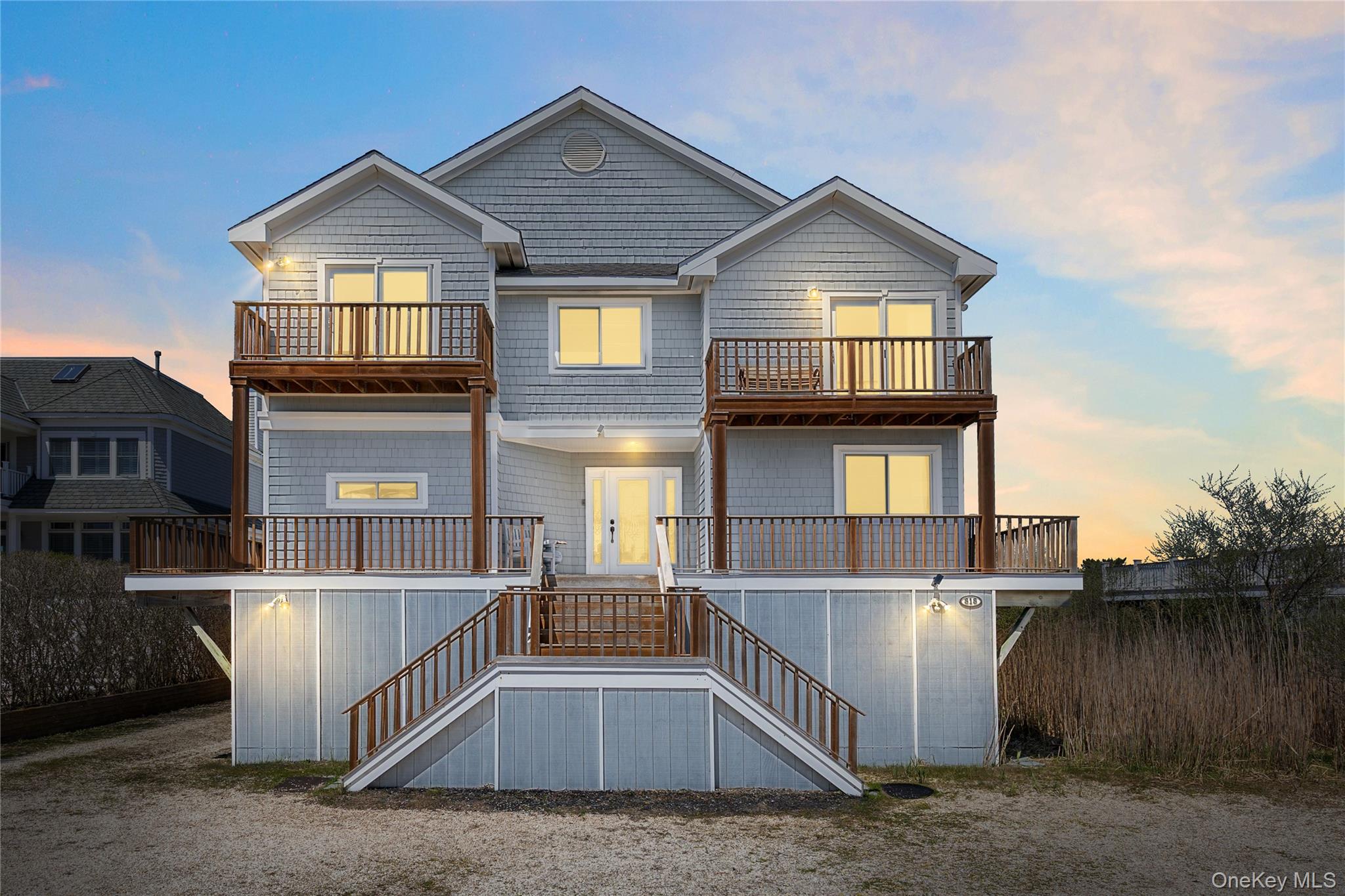818 Dune Road Westhampton Beach, NY 11978 - Photo 1 of 30 a view of a house with wooden fence