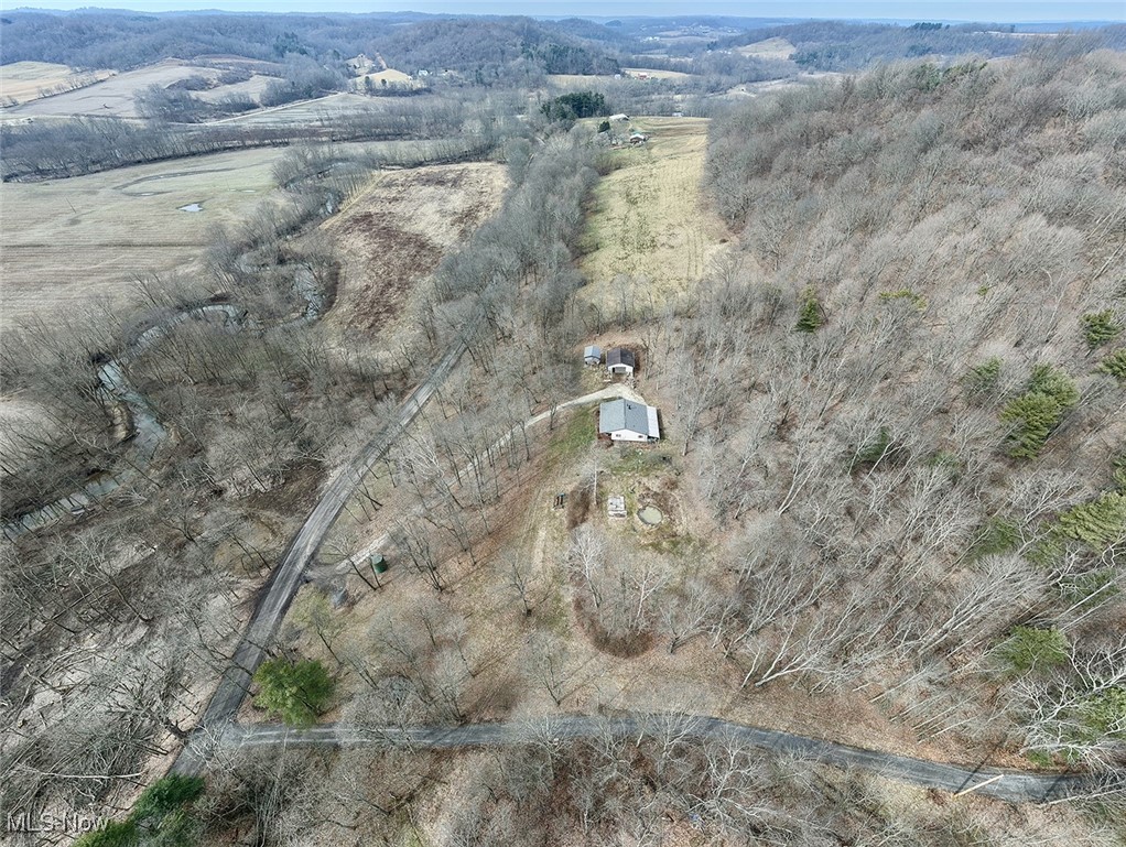 5295 Deer Road Southwest Bowerston, OH 44695 - Photo 31 of 39 Drone / aerial view with a mountain view
