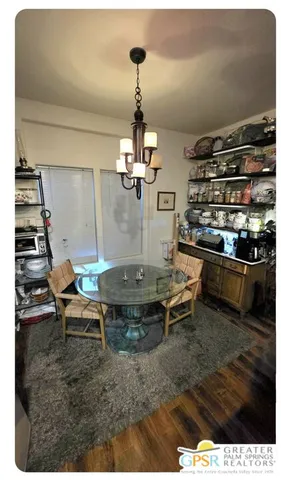 a kitchen with granite countertop a stove and a microwave