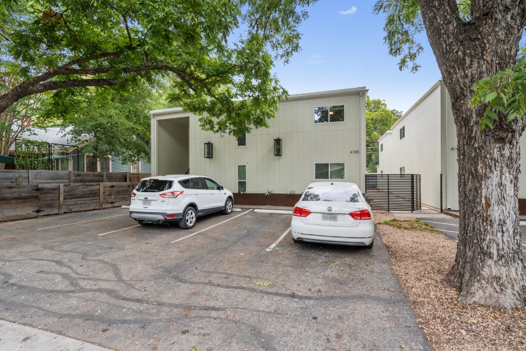 4105 Speedway, Unit 105 Austin, TX 78751 - Photo 12 of 14 a car parked in front of white house