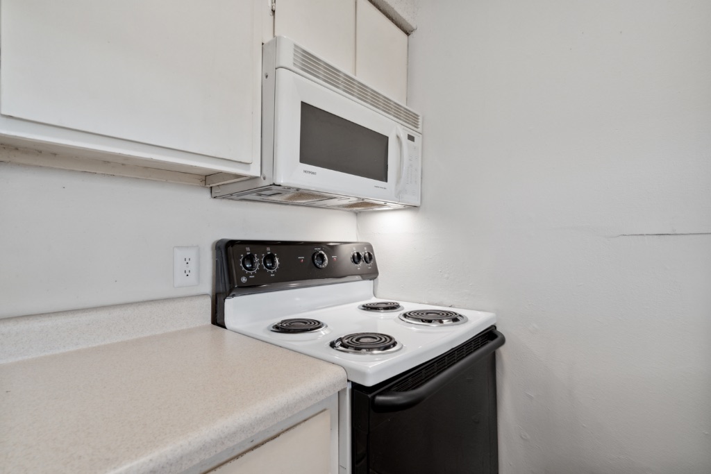 4105 Speedway, Unit 105 Austin, TX 78751 - Photo 7 of 14 a kitchen with a stove and a microwave