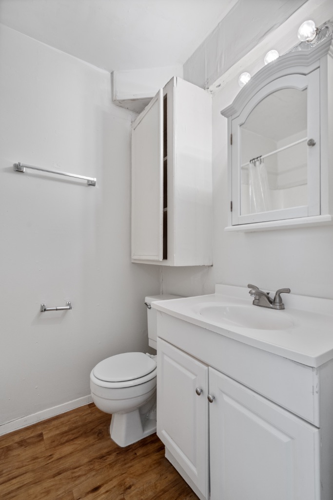 4105 Speedway, Unit 105 Austin, TX 78751 - Photo 10 of 14 a bathroom with a toilet sink and mirror