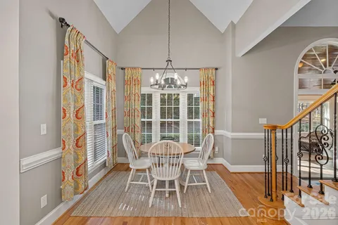 a outdoor space with patio the couches and kitchen view with wooden floor
