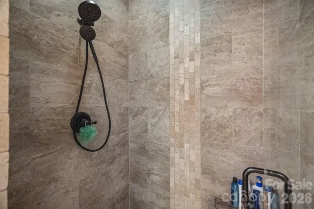 a bedroom with furniture and a potted plant