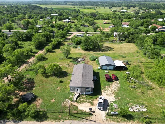 an aerial view of residential house with outdoor space