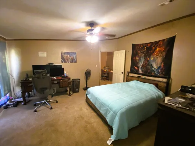 a bedroom with a bed and furniture