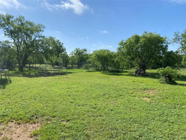 a view of outdoor space with deck and yard