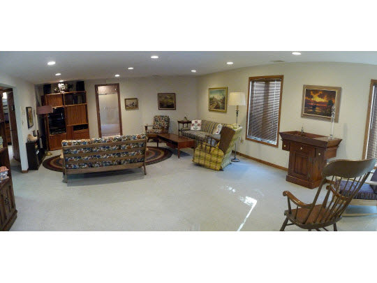 9605 Rambouillet Ridge Roscoe, IL 61073 - Photo 8 of 11 a living room with furniture and a flat screen tv