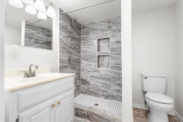 a kitchen with a refrigerator sink and cabinets