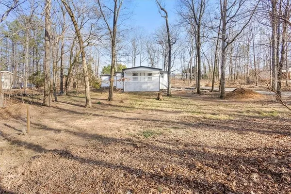 a view of street with large trees