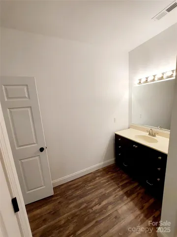 a bathroom with a sink and mirror