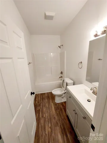 a bathroom with a sink a toilet and a bathtub
