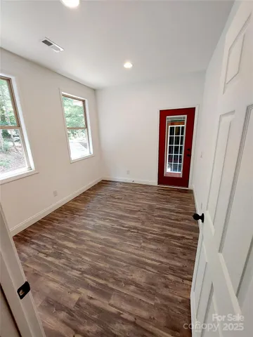 a view of an empty room with a window