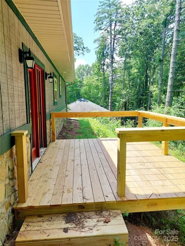 a view of swimming pool with a patio and a yard