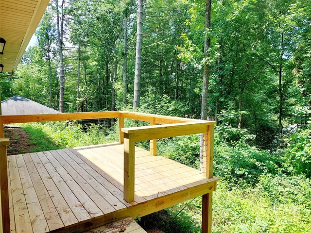 a view from deck with patio