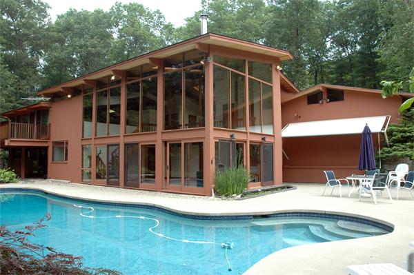 231 Judy Farm Road Carlisle, MA 01741 - Photo 1 of 1 a view of a house with swimming pool
