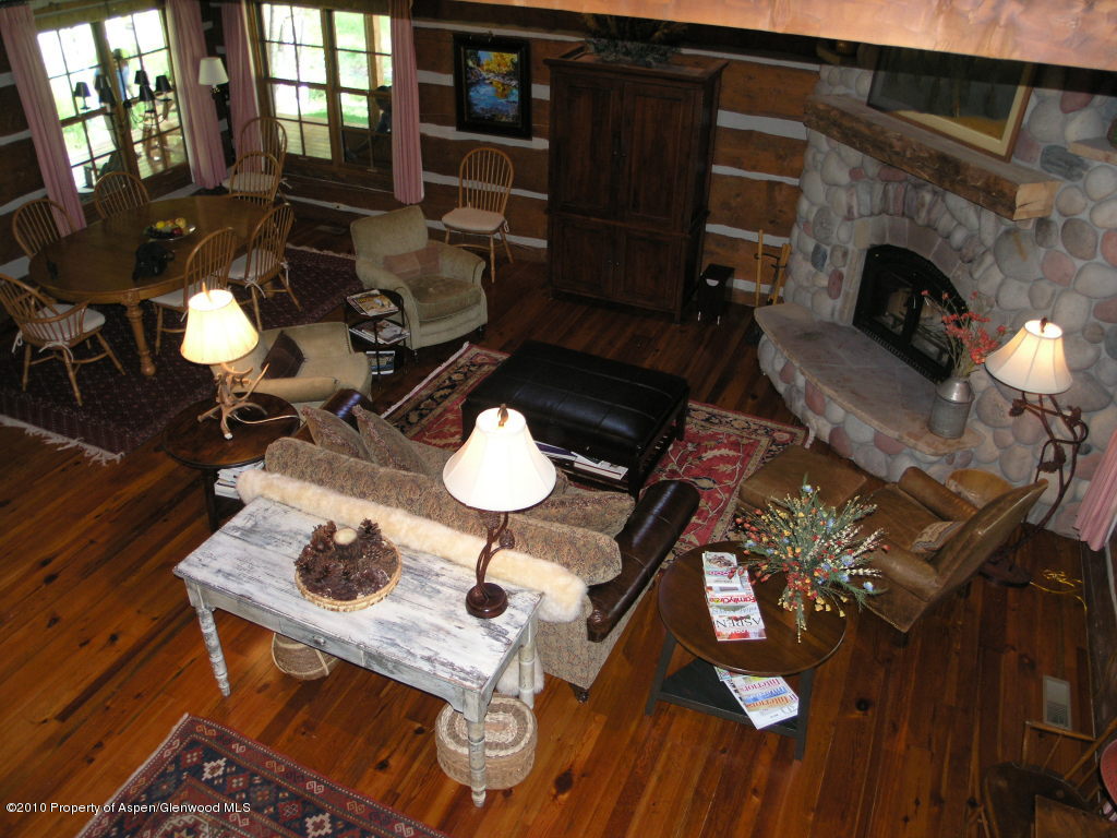 20 Altamira Ranch Road, Unit 1/4 INTEREST Basalt, CO 81621 - Photo 4 of 12 a living room with furniture and a fireplace